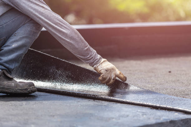 Professional Basement Waterproofing technician working in Fulton, IL